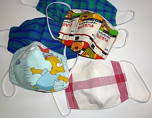 Decorated cloth face masks. Wearing a face covering in settings such as shops, bars, airports, and on public transport became mandatory in many countries in the early 2020s, in order to prevent the spread of COVID-19.