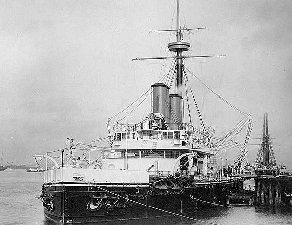 HMS Dreadnought shows the low freeboard typical for early ironclad turret-ships. This ship, launched in 1875, should not be confused with her famous s