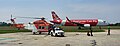 AW139 operated by Helistar Resources with Airasia A320 seen from Helistar Hangar apron