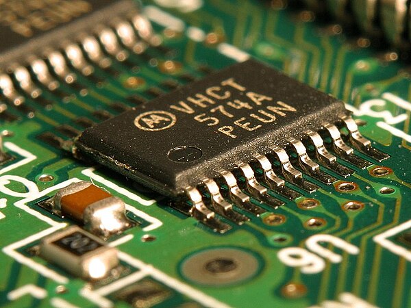 An integrated circuit (IC) on a printed circuit board. This is called a solid-state circuit because all of the electrical activity in the circuit occu
