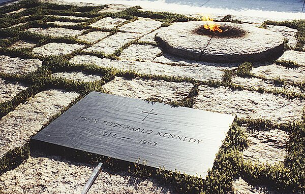 Slate headstone and Eternal Flame marking the grave of John F. Kennedy.