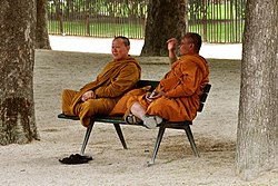 Two monks in orange robes Jardin des Plantes May 2009.jpg