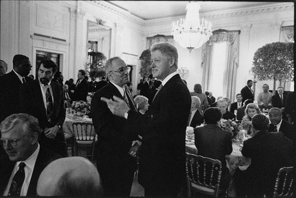 Jeremiah Wright (center left), in 1998, greeting President Bill Clinton during a prayer breakfast at the White House