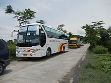 An FNLT bus in the Bataan Transit hybrid livery at Paombong, Bulacan JfSanto Nino4446BulPaombongfvf 11.JPG