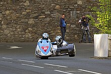 John Holden and Daniel Sayle (pictured in practice) took their second podium of the week in second sidecar race John Holden TT 2015.jpg