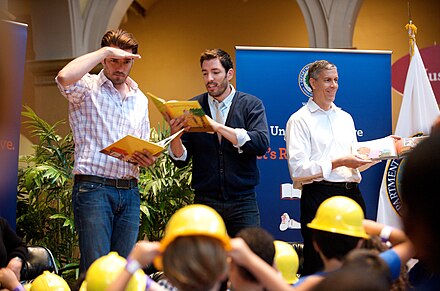 Jonathan and Drew Scott reading to children at the Let's Read Let's Move event on 6 August 2013 Jonathan and Drew Scott reading to children at the Let's Read Let's Move event on August 6, 2013.jpg