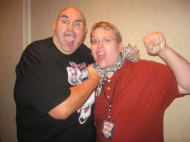 One Man Gang posing with a fan in October 2008 while holding his signature chain.