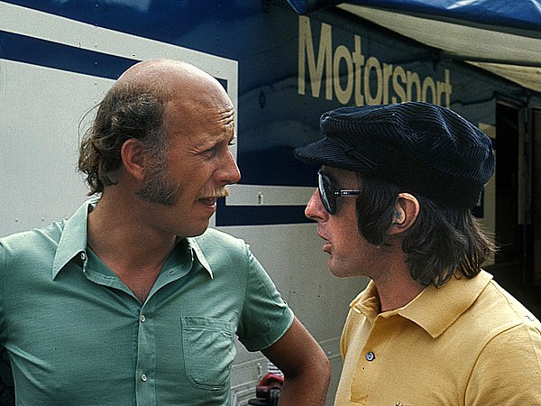 Kranefuss (left) in conversation with Jackie Stewart in 1973