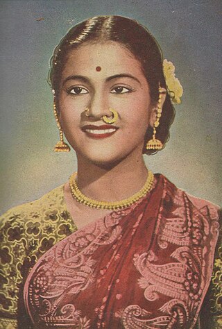 Young smiling Indian woman wearing a sari.