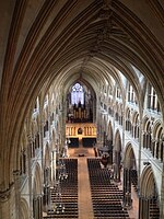 Nave of Lincoln Cathedral (begun 1185) showing three levels; arcades (bottom); tribunes (middle) and clerestory (top).