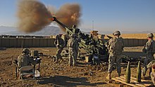 7-person gun crew firing a US M777 Light Towed Howitzer, War in Afghanistan, 2009 M777 Light Towed Howitzer 1.jpg