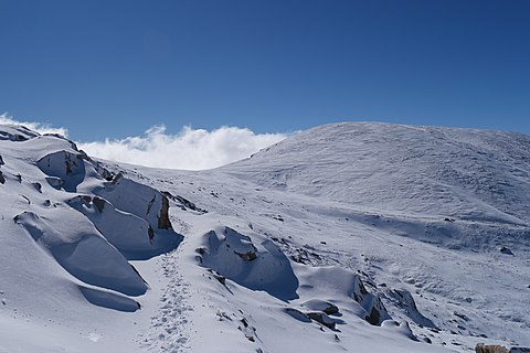 Main Range Track covered in snow near Mt Northcote and Mullers Peak in Kosciuszko National Park, New South Wales.