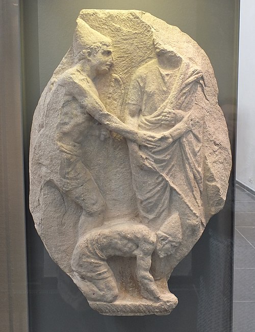 Relief depicting the manumission of two slaves, with pileus (1st century BCE, Musée de Mariemont).