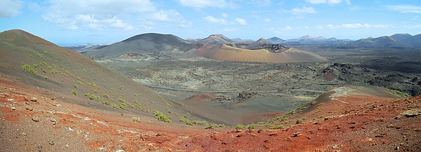 Panoramic view from the Ruta de los Volcanes on the Montaña del Selado (black, left, altitude 507 m) and the Caldera del Corazoncillo (altitude 251 m), Timanfaya National Park, Lanzarote