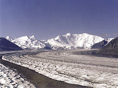 The Nabesna Glacier, with Mount Blackburn and its two summits at right; Atna Peaks is the twin summit left of center