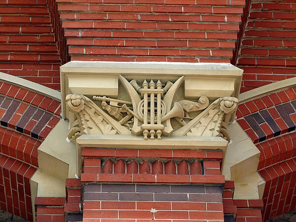 Detail of structure's music-themed ornamentation.