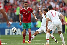 Offensive playmaker Hakim Ziyech (shirt number 7) - pictured with Morocco - playing against Portugal at the 2018 FIFA World Cup. Portugal-Morocco by soccer.ru 8.jpg