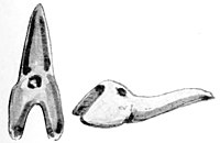 Left image is in the shape of a shark’s tooth, complete with the root, carved from greenstone. The right image is a side view.