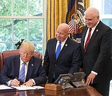 Kelly with President Trump as he signs the Taxpayer First Act into law President Trump Signs H.R. 3151 (48180040956) (cropped).jpg