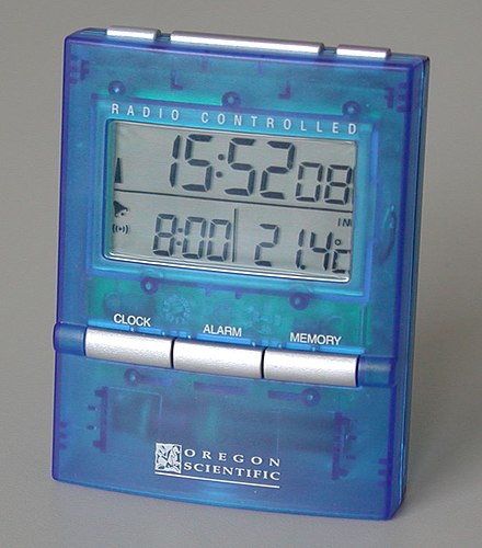 Digital clock.  The time shown by the digits on the face at any instant is digital data.  The actual precise time is analog data.