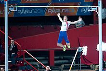 Renaud Lavillenie clears the bar at the Palais Omnisports Renaud Lavillenie Paris 2011.jpg