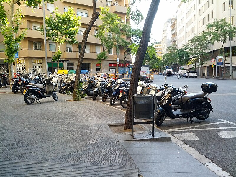 File:Row of motorcycles parked on the corner (18257330329).jpg