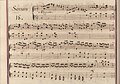 partitura manuscrita mejorada con colores rojo y azul descoloridos en los bordes