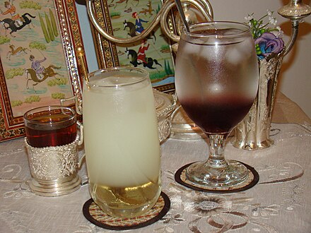 Two kinds of Iranian sharbat (center is lemon and right is cherry sharbat) along with Iranian tea (left)