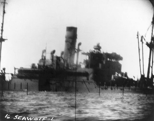 Periscope photo of a Japanese merchant ship sinking after being torpedoed by Seawolf.