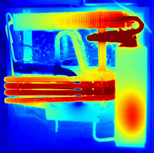 Thermal image of a Domestic absorption refrigerator of a comparable type to the one in the labelled image above. Colour indicates relative temperature: blue=cold, red is hottest. The heat source (7) is contained entirely within the insulation section (6).