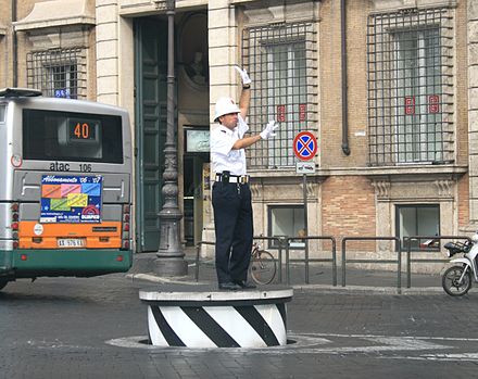 Traffic control in Rome, Italy. This traffic control podium can retract back to road level when not in use.