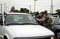 US Marine Corps (USMC) Military Police and Federal Security Police check the identification of motorist entering the main gate at Naval Air Station (NAS), San Diego, California (CA) enforcing heightened security 010911-N-MP226-002.jpg