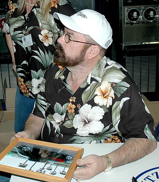 Coddington from American Hot Rod signs autographs aboard the nuclear-powered aircraft carrier Nimitz in 2005