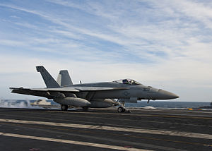 US Navy 120121-N-FI736-165 An F-A-18F Super Hornet assigned to the Thunderbolts of Strike Fighter Squadron (VFA) 136, takes off from the flight dec.jpg