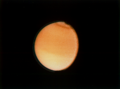 Another image of Titan taken by Voyager 2 on August 23, 1981 a few months after Voyager 1 arrived at Saturn first. The spacecraft was around 2,300,000 kilometres or 1,400,000 miles away from the moon.[226]