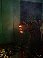 Women lighting earthen lamps on occasion of 2017 Sandhi puja at Manikanchan 22