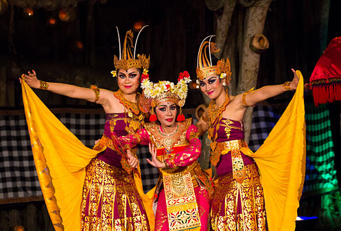 Three dancers posing together