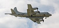 A P-3C Orion, tail number 161588, on final approach to Kadena Air Base in Okinawa, Japan. It has an AN/APS-149 Littoral Surveillance Radar System (LSRS) mounted underneath it.