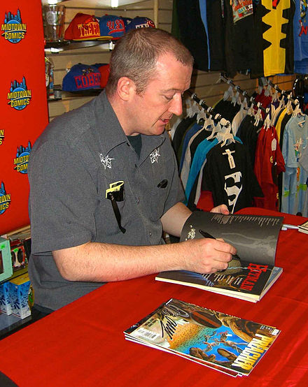 Ennis signing copies of Hitman and Preacher at a 19 April 2012 appearance at Midtown Comics Downtown in Manhattan