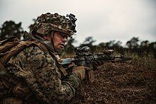 A US Marine with an M27 fitted with an ACOG Rifle Combat Optic and an OKC-3S bayonet. 4th MARDIV Rifle Squad Competition- Day 3 230130-M-SU940-1631.jpg