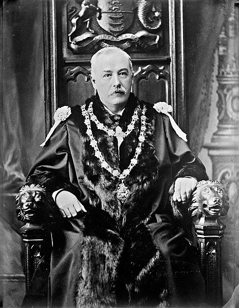 File:A distinguished gentleman in robes and chain of office sitting on a throne (of sorts) (29905539612).jpg