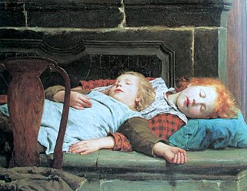 Twee slapende meisjes voor de oven