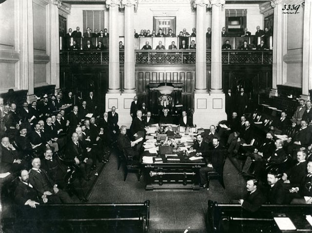 Australia's first prime minister, Edmund Barton, at the central table in the House of Representatives in 1901.