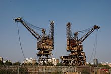 Coal was usually brought to the station by colliers, and unloaded by cranes, which are still intact on the station's riverfront. Battersea Power Station in London 3.jpg