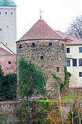 Tower of the Röhrscheidtbastei made of natural stone with a helmet roof and weather vane (individual monument for ID-Nr. 09301008)