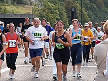 Fun runners on the Portway in the 2006 Bristol Half Marathon. The canopy over the road under the Clifton Suspension Bridge is visible in the background. Bristol Half Marathon.jpg