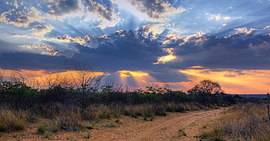 Crepuscular rays at Sunset near Waterberg Plateau edit.jpg