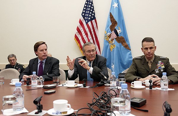 Burns and Secretary of Defense Donald Rumsfeld at NATO headquarters in Brussels on December 2, 2003