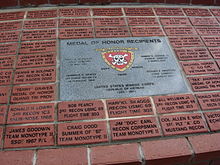USMC 3rd Reconnaissance Battalion memorial, center marble stone is for Medal of Honor recipients, red bricks above and below: team "Flight Time" Ocala, Florida FT Monument.JPG