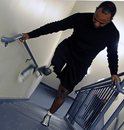 Patient at Walter Reed test next-generation prosthesis walking stairs